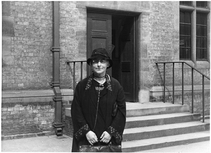 Photograph of Gabriele Rabel, standing outside a building