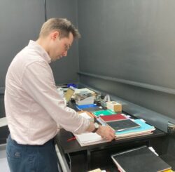 Matthew Hurst sorting through a new accession to the Archives Centre.