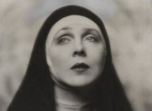 A black and white photograph of Lady Diana Cooper dressed as a nun