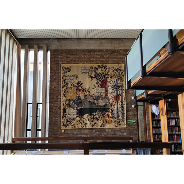 A photograph of the Lurcat tapestry hanging in the Bracken Library, Churchill College