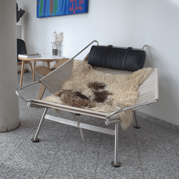 A photograph of a Flag Halyard Chair, as designed by Hans J Wegner