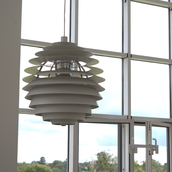 A photograph of a Henningsen Louvre lamp hanging in the Moller Institute.