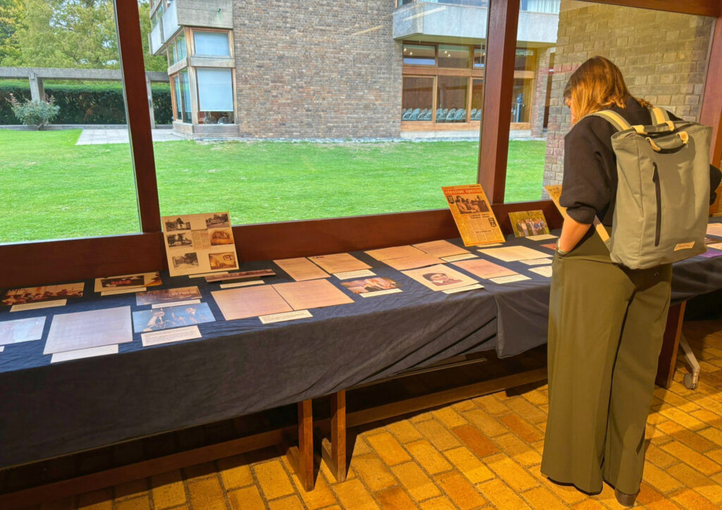An attendee looks at the display of copies of archive material